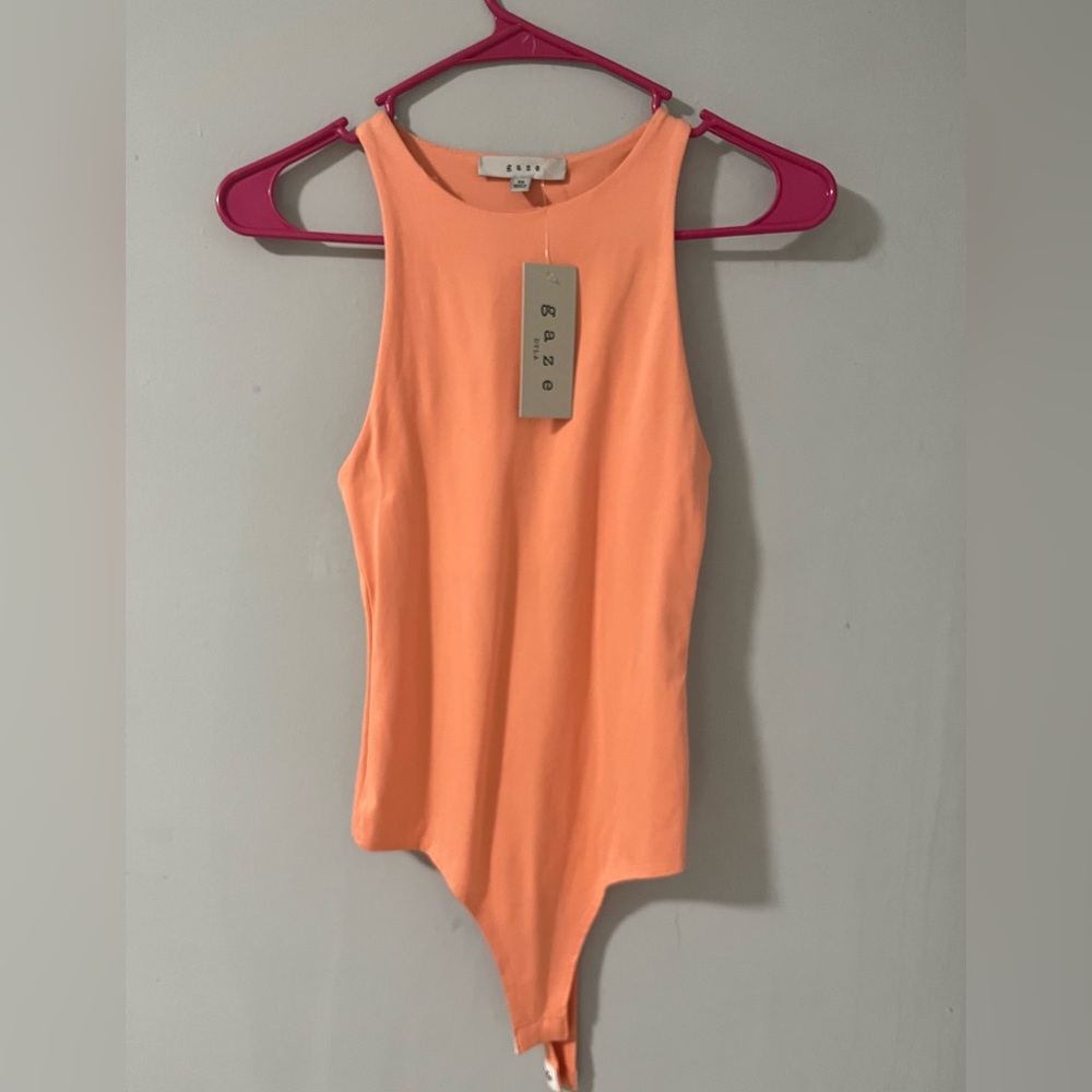 Peach color bodysuit no sleeves New w/Tags